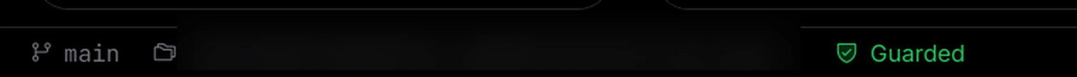 The left end of the Torki Code status bar showing the branch main, a folder icon with the folder path hidden, and a green shield labelled Guarded
