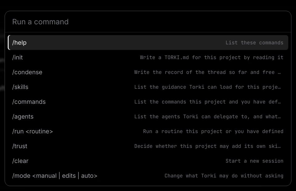 The command list opened by typing a slash in the composer, showing /help, /init, /condense, /skills, /commands, /agents, /run, /trust, /clear and /mode with a short description each